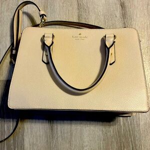 A beautiful rarely used purse with a shoulder strap.